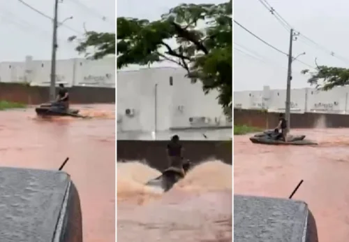 Morador usa moto aquática em rua após chuva causar alagamentos em Araguaína